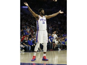 Philadelphia 76ers center Joel Embiid (21) gestures to the crowd during the first half on an NBA basketball game against the Detroit Pistons, Saturday, Nov. 3, 2018, in Philadelphia.