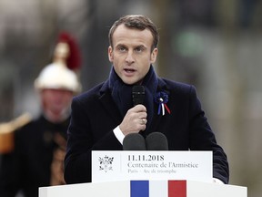 French President Emmanuel Macron delivers his speech as he attends a commemoration ceremony for Armistice Day, 100 years after the end of the First World War at the Arc de Triomphe in Paris, France, Sunday, November 11, 2018.