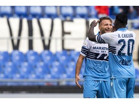 Lazio's Ciro Immobile, left, celebrates with his teammate Felipe Caicedo after scoring his side's 2nd goal during the Serie A soccer match between Lazio and Spal at the Olympic stadium in Rome, Sunday, Nov. 4, 2018.