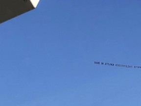 A plane flies over MetLife Stadium with a message that reads "SHAME ON JETS/MGM #ENDGUNVIOLENCE #STOPMGM" ahead of an NFL football game between the New York Jets and the Buffalo Bills in New York on Sunday, Nov. 11, 2018.