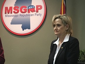 Republican U.S. Sen. Cindy Hyde-Smith of Mississippi appeared at a news conference at the state Republican Party headquarters in Jackson, Miss., on Monday, Nov. 12, 2018, and said repeatedly that she would not answer questions about a video that showed her at a Nov. 2 campaign event in Tupelo, Miss., where she praised a man by saying: "If he invited me to a public hanging, I'd be on the front row." Hyde-Smith issued a statement Sunday saying the remark was "an exaggerated expression of regard" for a friend who invited her to speak, and "any attempt to turn this into a negative connotation is ridiculous." Hyde-Smith was appointed to serve temporarily in the Senate after longtime Republican Sen. Thad Cochran retired in April, and she faces an African-American Democrat, Mike Espy, in a Nov. 27, 2018, runoff. Espy is a former congressman and former U.S. agriculture secretary. The runoff winner will serve the final two years of the six-year term started by Cochran.