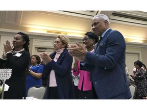 Mississippi Democratic Senate candidate Mike Espy applauds U.S. Sen. Kamala Harris, a California Democrat and possible 2020 presidential candidate, during an event Saturday, Nov. 17, 2018 in Jackson, Miss. Harris traveled to Mississippi to support Espy, who faces Republican Cindy Hyde-Smith in a Nov. 27 runoff for the remaining two years on a six-year U.S. Senate term.