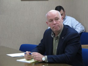 In this Tuesday, Oct. 9, 2018 photo Rep. Greg Gianforte listens during a meeting with leaders from the Montana Department of Justice and Montana Highway Patrol in Helena, Mont.. Gianforte is running against Democratic challenger Kathleen Williams to keep the congressional seat he won last year in a special election.