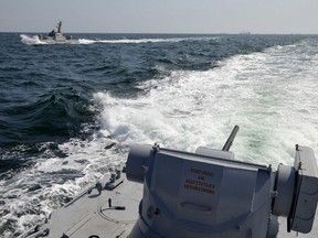 In this file photo taken and distributed by Ukrainian Navy Press Service on Sunday, Nov. 25, 2018, two Ukrainian forces navy ships are seen near Crimea.