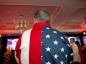 An attendee wears an American flag themed shirt during an election night rally for Rick Scott, governor of Florida and Republican U.S. Senate Candidate, in Naples, Florida, U.S., on Tuesday, Nov. 6, 2018.