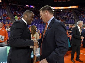Clemson head coach Brad Brownell, right, greets North Carolina Central head coach LeVelle Moton before the start of an NCAA college basketball game, Friday, Nov. 9, 2018, in Clemson, S.C.