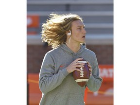 Clemson quarterback Trevor Lawrence passes the ball during drills before the start of an NCAA college football game against Louisville Saturday, Nov. 3, 2018, in Clemson, S.C.