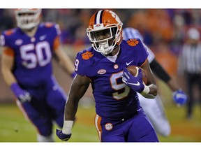 Clemson's Travis Etienne rushes out of the backfield during the first half of an NCAA college football game against Duke on Saturday, Nov. 17, 2018, in Clemson, S.C.