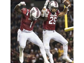 South Carolina running back A.J. Turner (25) and Deebo Samuel (1) celebrate a touchdown against Chattanooga during the first half of an NCAA college football game Saturday, Nov. 17, 2018, in Columbia, S.C.