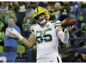 Green Bay Packers tight end Robert Tonyan (85) reacts after catching a pass for a touchdown against the Seattle Seahawks during the first half of an NFL football game, Thursday, Nov. 15, 2018, in Seattle.
