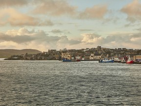 A ferry approaches Lerwick Harbor on the Shetland Islands in Scotland, Oct. 2018. Shetland Wool Week is hailed as the worldwide mecca of knitting festivals but the islands have a rich, complex history beyond that of the textiles industry.