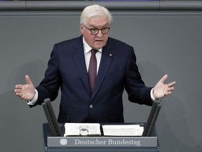 German President Frank-Walter Steinmeier delivers a speech during an hour of commemoration in the German federal parliament, Bundestag, at the Reichstag building in Berlin, Germany, Friday, Nov. 9, 2018. Bundestag members are commemorating the Night of Broken Glass pogroms of 1938, in which Nazi supporters burned and vandalized synagogues and Jewish businesses across the country, killing over 400 people, but also the creation of the first German republic in 1918 as well as the fall of the Berlin Wall in 1989. All three events occurred on November 9.