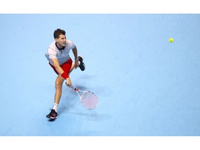Austria's Dominic Thiem returns to Japan's Kei Nishikori during their men's singles match on day five of the ATP Finals at The O2 Arena, London, Thursday Nov. 15, 2018.