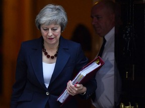 Britain's Prime Minister Theresa May leaves 10 Downing Street in London on November 14, 2018, to attend the weekly Prime Minister's Questions at the Houses of Parliament.