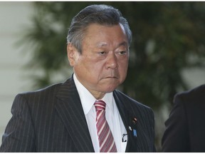 In this Oct. 2, 2018, file photo, Japan's Minister in Charge of Tokyo Olympics Yoshitaka Sakurada arrives at the prime minister's official residence in Tokyo. Sakurada, also the minister in charge of cybersecurity, is in the spotlight for acknowledging he had never used a computer and making comments showing he had no idea what a USB port might be.