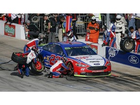 Joey Logano's pit crew services his car during a NASCAR Cup auto race at Texas Motor Speedway, Sunday, Nov. 4, 2018, in Fort Worth, Texas.