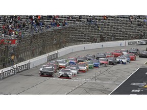 The field crosses the starting line for the NASCAR Xfinity Series O'Reilly Auto Parts 300 at Texas Motor Speedway, Saturday, Nov. 3, 2018, in Fort Worth, Texas.