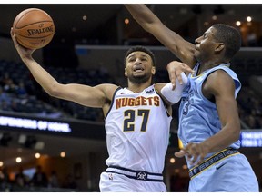 Denver Nuggets guard Jamal Murray (27) shoots against Memphis Grizzlies forward Jaren Jackson Jr. (13) in the first half of an NBA basketball game Wednesday, Nov. 7, 2018, in Memphis, Tenn.