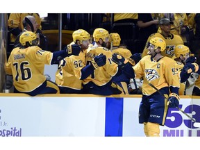 Nashville Predators defenseman Roman Josi (59), of Switzerland, is congratulated after scoring a goal against the Boston Bruins during the first period of an NHL hockey game Saturday, Nov. 3, 2018, in Nashville, Tenn.