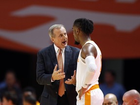 Tennessee coach Rick Barnes talks to guard Jordan Bone during the first half of the team's NCAA college basketball game against Louisiana-Lafayette on Friday, Nov. 9, 2018, in Knoxville, Tenn.