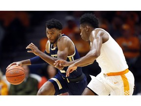 Georgia Tech guard Shembari Phillips (2) drives as he's defended by Tennessee guard Admiral Schofield (5) during the first half of an NCAA college basketball game Tuesday, Nov. 13, 2018, in Knoxville, Tenn.