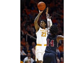 Tennessee guard Jordan Bowden (23) shoots over Lenoir-Rhyne guard Cory Thomas (14) during the first half of an NCAA college basketball game Tuesday, Nov. 6, 2018, in Knoxville, Tenn.