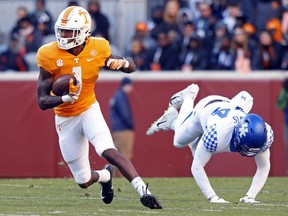 Tennessee wide receiver Marquez Callaway (1) escapes from Kentucky linebacker Jamin Davis (44) in the first half of an NCAA college football game Saturday, Nov. 10, 2018, in Knoxville, Tenn.