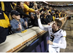 Missouri quarterback Drew Lock (3) celebrates with fans after his team defeated Tennessee 50-17 in an NCAA college football game Saturday, Nov. 17, 2018, in Knoxville, Tenn.