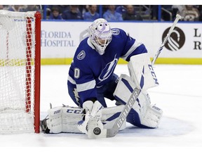 Tampa Bay Lightning goaltender Louis Domingue (70) makes a stick save on a shot by the Buffalo Sabres during the first period of an NHL hockey game Thursday, Nov. 29, 2018, in Tampa, Fla.