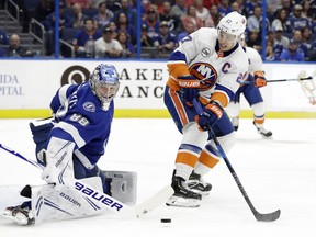 New York Islanders left wing Anders Lee (27) shoots wide of Tampa Bay Lightning goaltender Andrei Vasilevskiy (88) during the first period of an NHL hockey game Thursday, Nov. 8, 2018, in Tampa, Fla.