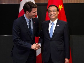 Prime Minister Justin Trudeau meets with Chinese Premier Li Keqiang before the Canada-China Annual Leaders dialogue in Singapore on Nov. 14, 2018.