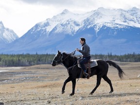 Prime Minister Justin Trudeau rides a black horse to the ceremony with the Chiefs of the Tsilhqot'in National Government, symbolizing the one the chiefs rode into what they believed were peace talks.