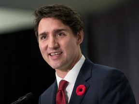 Prime Minister Justin Trudeau addresses the Vancouver Board of Trade, in Vancouver, on Thursday November 1, 2018. In an interview with CNN, portions of which are airing as U.S. voters cast ballots in pivotal midterm elections, Trudeau says Canada still wants the tariffs lifted before the new version of NAFTA goes into effect.