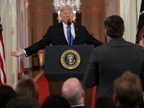 President Donald Trump answers a question from CNN journalist Jim Acosta during a news conference in the East Room of the White House, Wednesday, Nov. 7, 2018, in Washington.