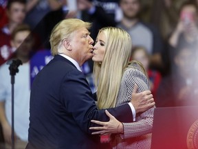 President Trump, left, kisses Ivanka Trump, during a rally in Fort Wayne, Ind., on Monday.