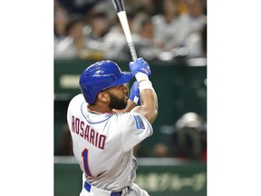 MLB All-Star shortstop Amed Rosario (1) of the New York Mets watches his solo home-run off All Japan's starting pitcher Takayuki Kishi in the third inning of Game 1 of their All-Stars Series baseball at Tokyo Dome in Tokyo, Friday, Nov. 9, 2018.