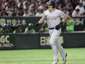 MLB All-Star designated hitter J.T. Realmuto of the Miami Marlins rounds third base after hitting a solo home run off All Japan starter Shinsaburo Tawata in the fourth inning of Game 3 of their All-Stars Series baseball at Tokyo Dome in Tokyo, Sunday, Nov. 11, 2018.