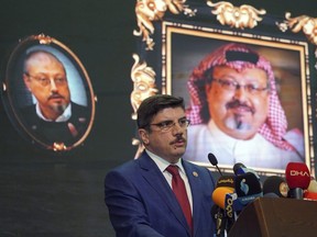 Yasin Aktay, an adviser to Turkey's President Recep Tayyip Erdogan, speaks during an event organized to mark the 40th day of the death of Saudi writer Jamal Khashoggi, in Istanbul, late Sunday, Nov. 11, 2018.