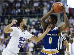 Cal State Bakersfield guard Jarkel Joiner (0) looks for room against TCU guard Alex Robinson (25) during the first half of an NCAA college basketball game, Wednesday, Nov. 7, 2018, in Fort Worth, Texas.