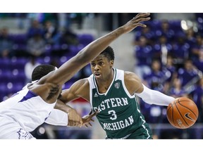 Eastern Michigan guard Paul Jackson (3) looks for room against TCU forward JD Miller (15) during the first half of an NCAA college basketball game Monday, Nov. 26, 2018, in Fort Worth, Texas.