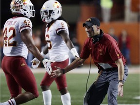 Iowa State head coach Matt Campbell, right, receives his players to the sideline during the first half of an NCAA college football game against Texas , Saturday, Nov. 17, 2018, in Austin, Texas.