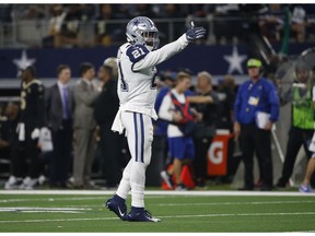 Dallas Cowboys running back Ezekiel Elliott (21) signals first down following a run against the New Orleans Saints during the second half of an NFL football game, in Arlington, Texas, Thursday, Nov. 29, 2018.