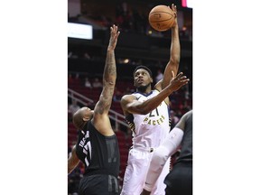 Indiana Pacers forward Thaddeus Young, right, shoots over Houston Rockets forward PJ Tucker during the first half of an NBA basketball game, Sunday, Nov. 11, 2018, in Houston.