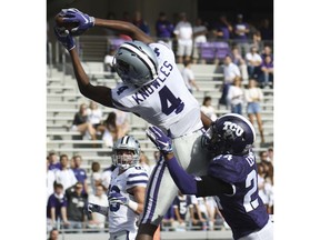 Kansas State's Malik Knowles, top, brings down a catch over TCU's Julius Lewis for the touchdown in the second quarter of an NCAA college football game, Saturday, Nov. 3, 2018, in Fort Worth, Texas.