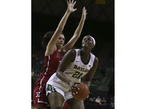 Baylor center Kalani Brown, right, is guarded by Saint Francis center Courtney Zezza during the first half of an NCAA college basketball game Thursday, Nov. 8, 2018, in Waco, Texas.