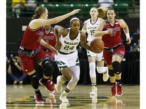 Baylor guard Chloe Jackson (24) drives past Nicholls State guard Cassidy Barrios, left, in the first half of an NCAA college basketball game on Tuesday, Nov. 6, 2018, in Waco, Texas.