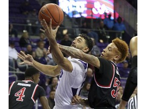 TCU guard Alex Robinson (25) is fouled by Fresno State guard Noah Blackwell (55) during the first half of an NCAA college basketball game Thursday, Nov. 15, 2018, in Fort Worth, Texas.