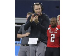 Texas Tech head coach Kliff Kingsbury encourages his players in the second half of an NCAA college football game against Baylor, Saturday, Nov 24, 20178, in Arlington, Texas.