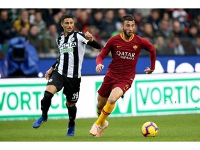 Udinese's Rolando Mandragora, left, and Roma's Bryan Cristante go for the ball during the Serie A soccer match between Udinese and Roma at the Friuli stadium in Udine, Italy, Saturday, Nov. 24, 2018.