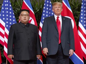In this June 12, 2018, file photo, U.S. President Donald Trump, right, stands with North Korean leader Kim Jong Un on Sentosa Island in Singapore. North Korea and the United States are trying to revive stalled diplomacy meant to rid the North of its nuclear weapons.
